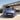 A woman entering the driver's side of the new i10 Hyundai.